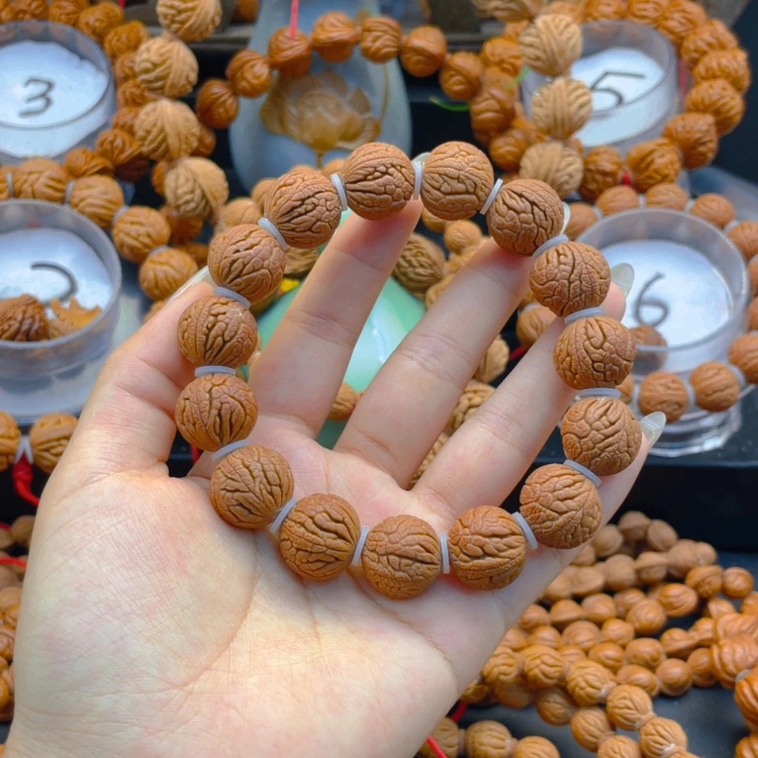 桃核手串1甲骨文。1.7。杜杜杜