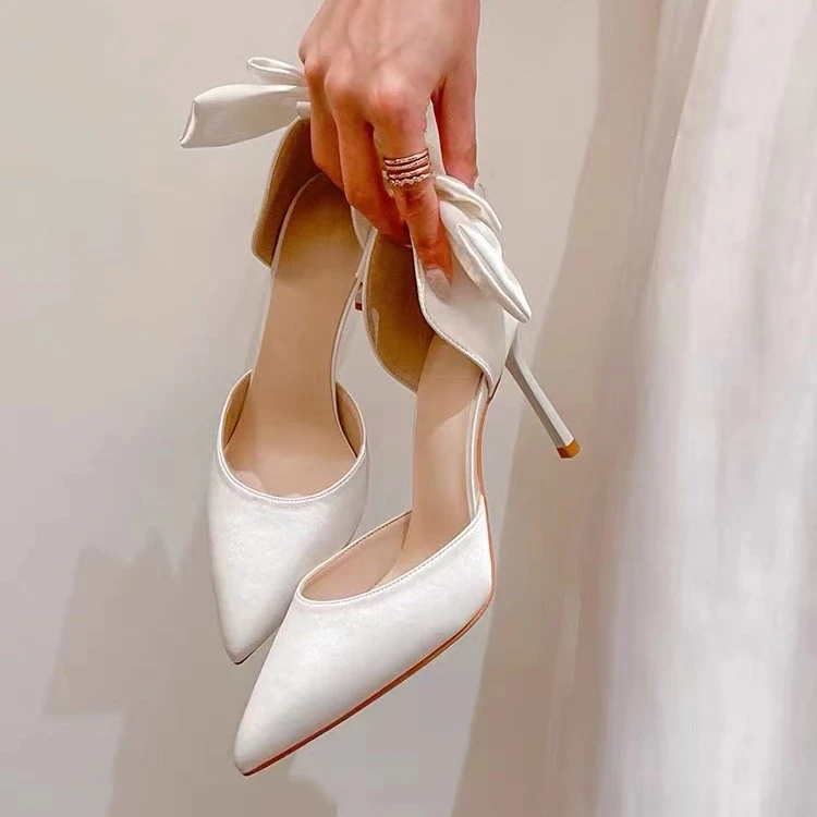 129白色后蝴蝶结中空细跟鞋