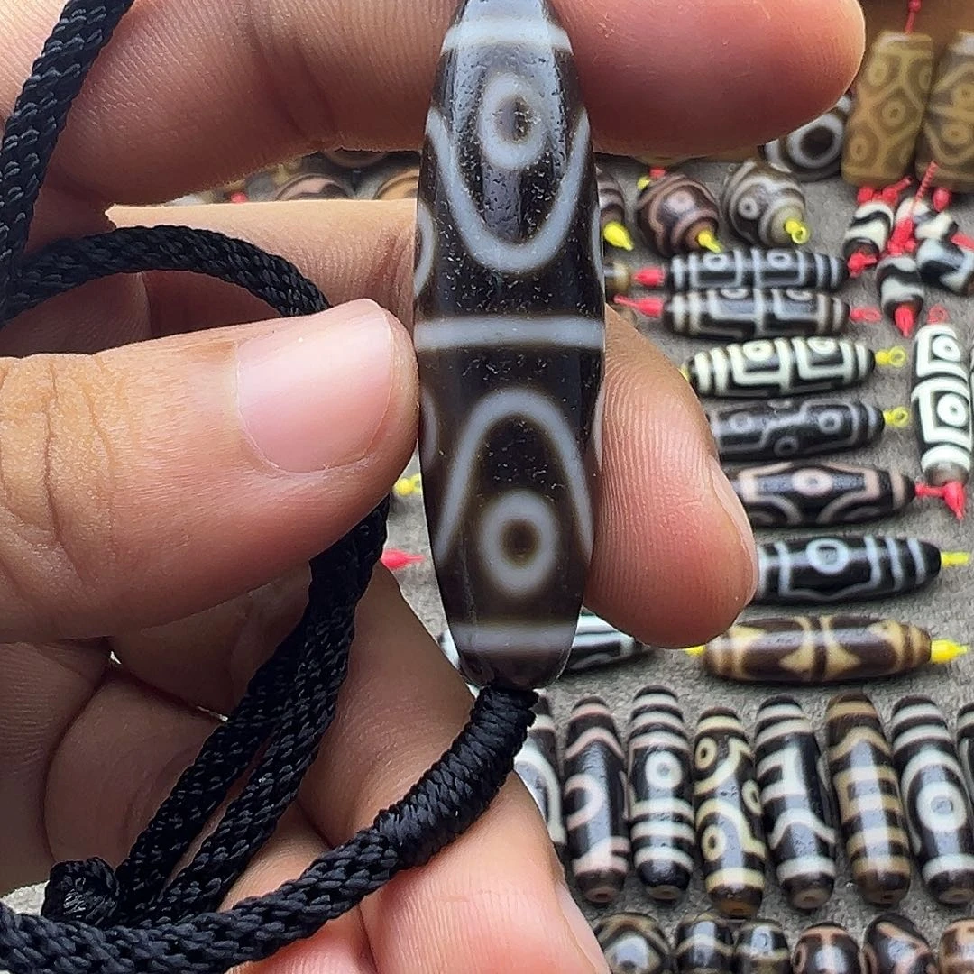 玖***梦玛瑙/玉髓未镶嵌吊坠(不含链)天曲贡水纹八眼天珠