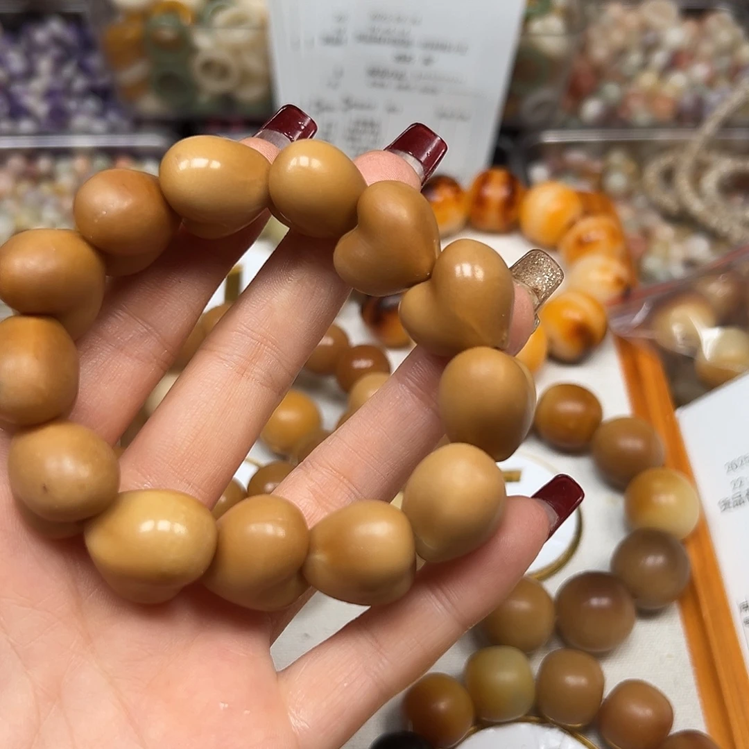 冰***斌手串菩提根/象牙果瑕疵咖爱心13颗有裂