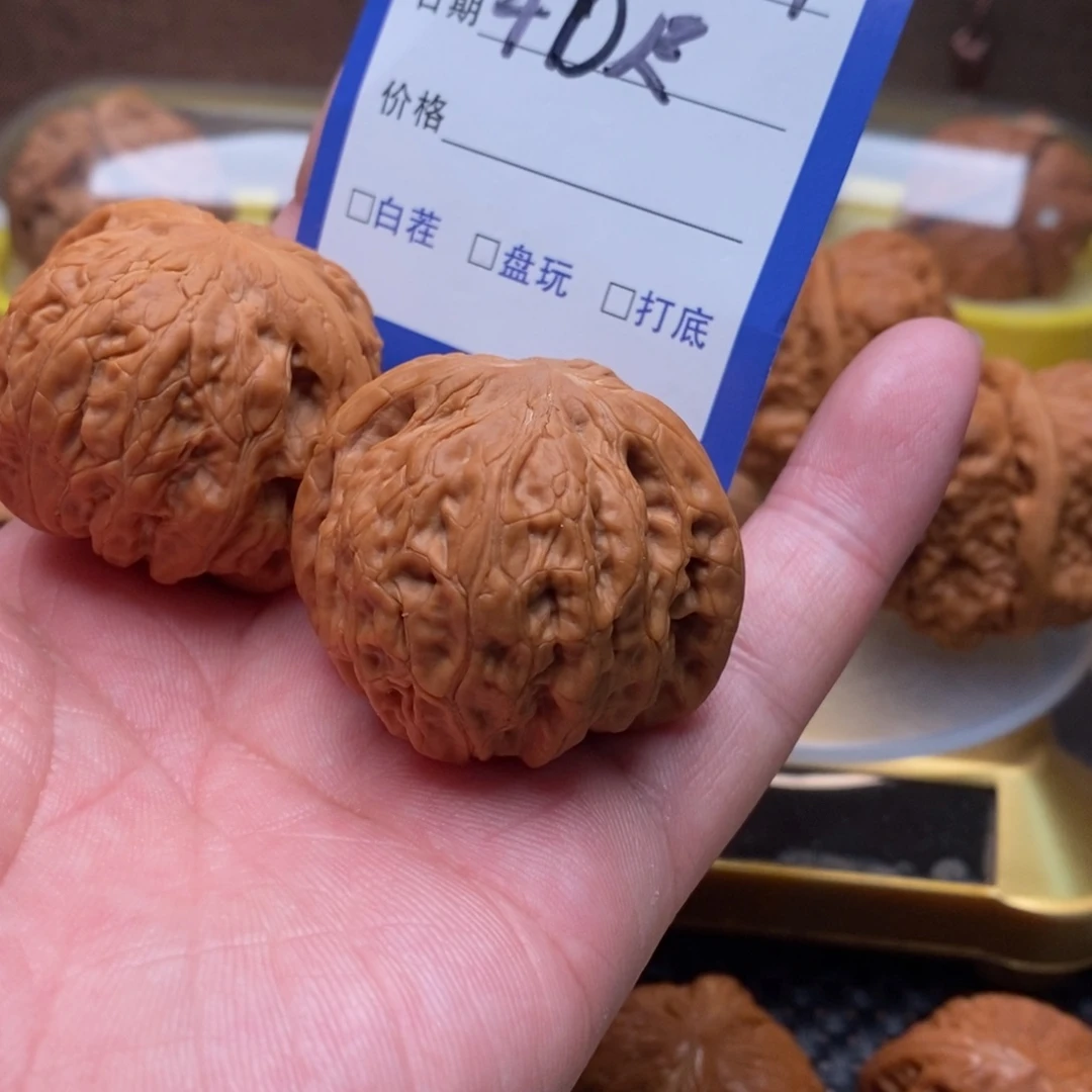 文玩核桃吊坠江****听铁锤40