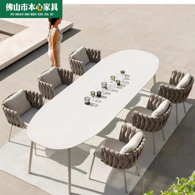 户外桌椅庭院阳台休闲区布置北欧室外休闲防水藤编组合餐椅长桌