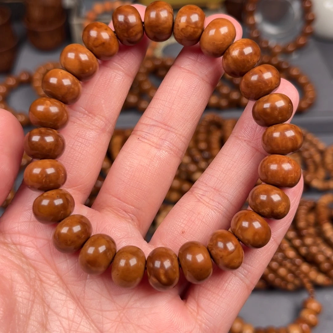 慕***夏果皮9*12算盘珠单圈手串