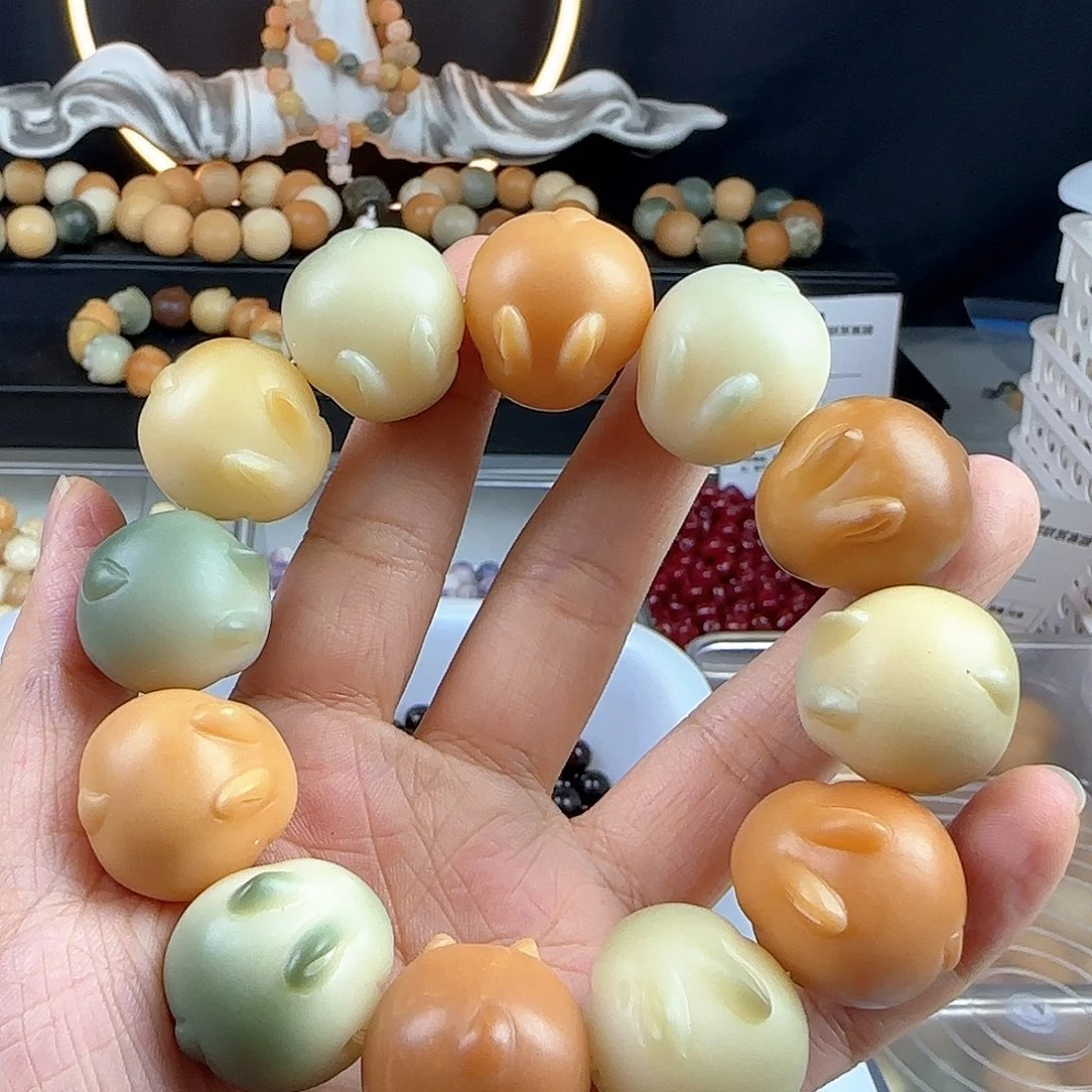 菩提根/象牙果手串E***n瑕疵卡22兔子1串