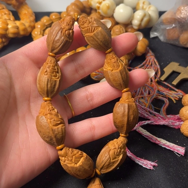 橄榄核手串包一财神