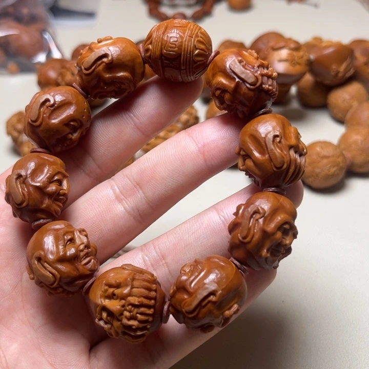 黄***王橄榄核手串十八罗汉