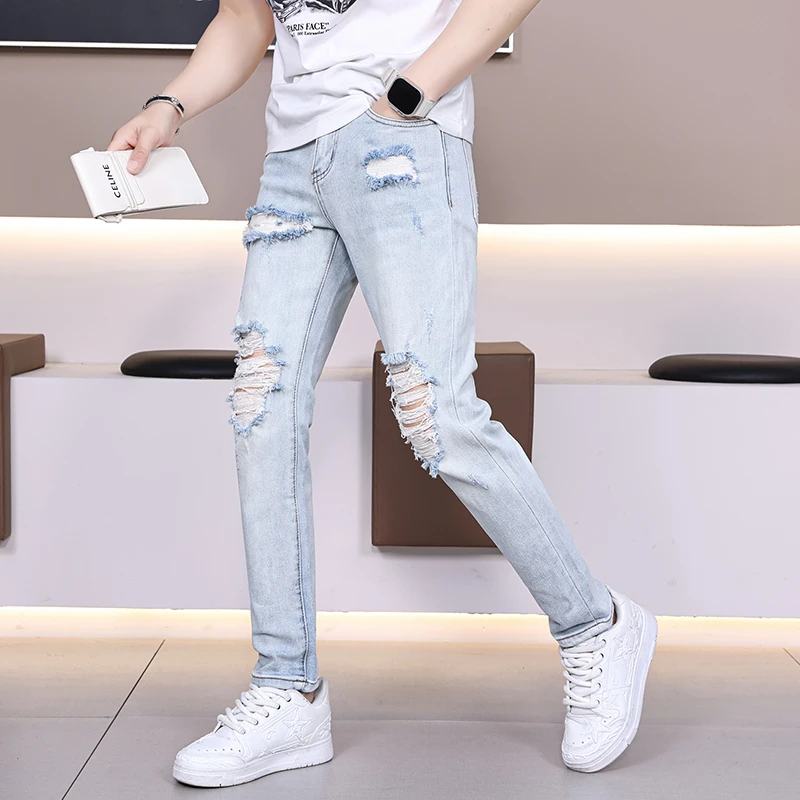 春夏款浅蓝色破洞男士牛仔裤欧版潮牌百搭修身弹力百搭长裤91501