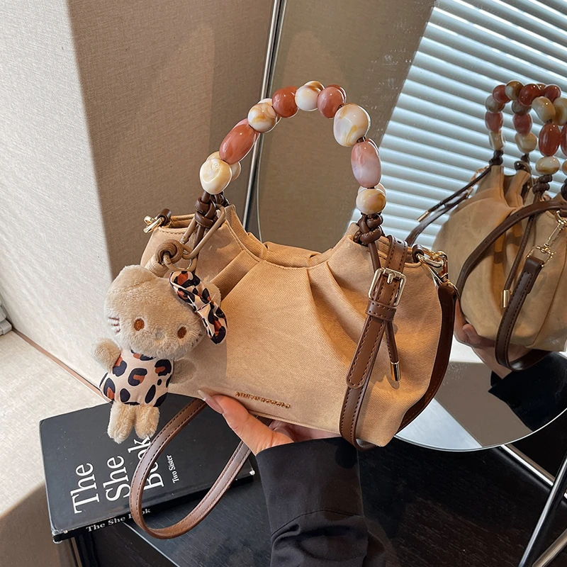 艾米兔女包2025新款时尚百搭串珠手提设计简约单肩斜挎褶皱云朵包