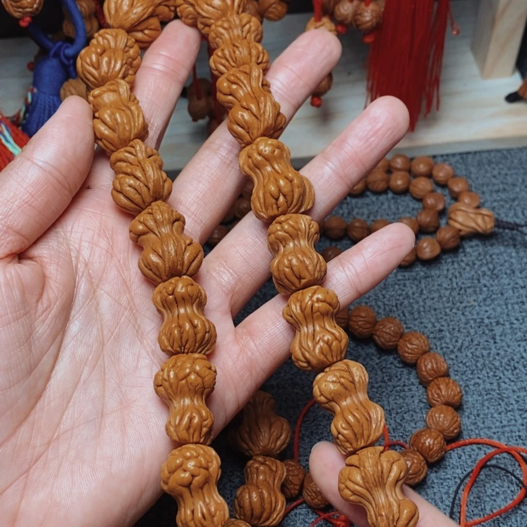 桃核吊坠桃枭手持1