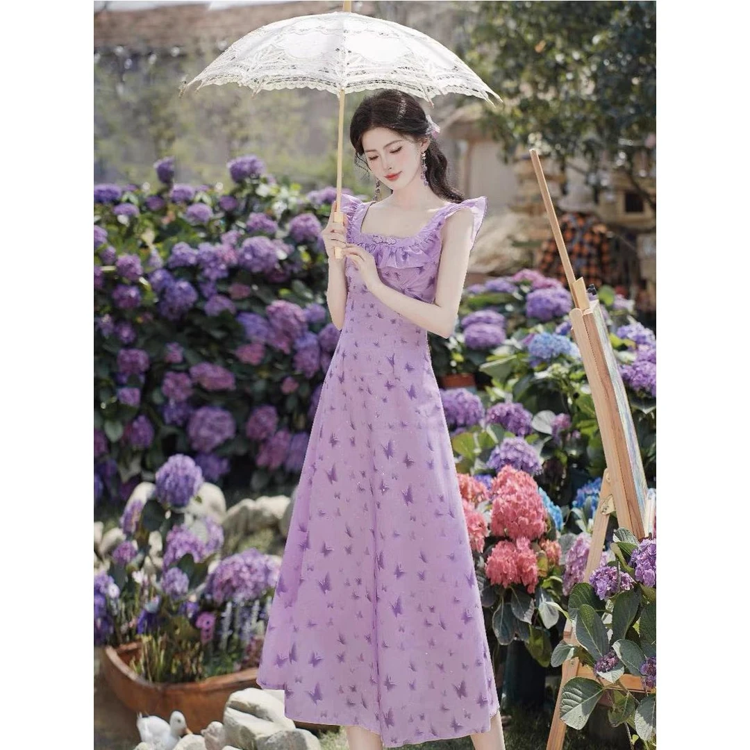 吊带连衣裙子女夏季海边度假长裙2024新款紫色茶歇法式小飞袖碎花