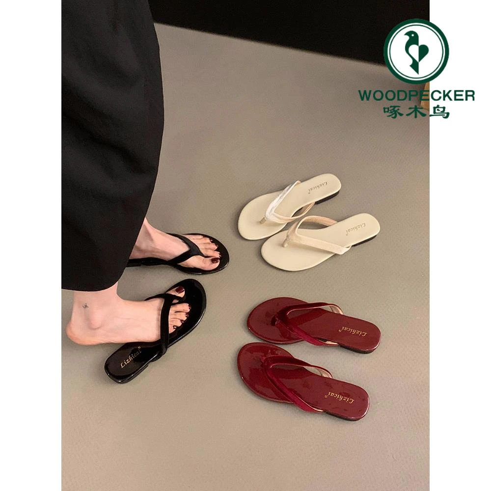啄木鸟平底人字凉拖外穿2025夏季新款气质仙女风度假沙滩夹趾拖鞋