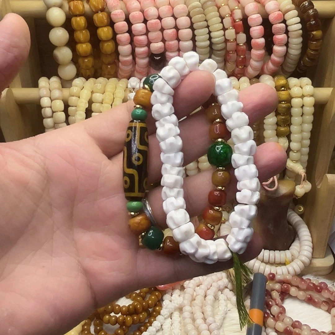 季***枪桃核把件鹿角龙脊天珠驼骨