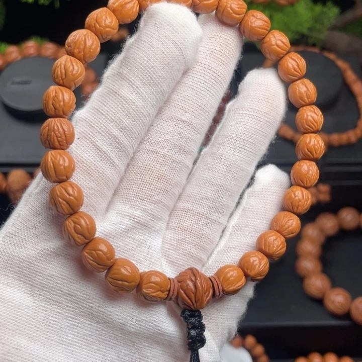 柉***熙木质类精品桃核手持