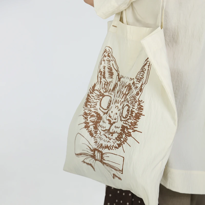 嬉游记原创2025夏新款线条猫猫大容量单肩包女上班通勤简约手提袋