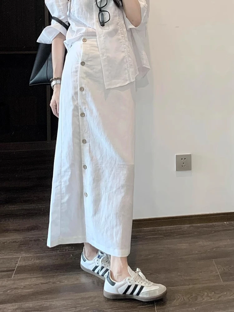 2025夏季设计感美式洋气时髦感白色时尚半身裙侧排扣一片式直筒裙