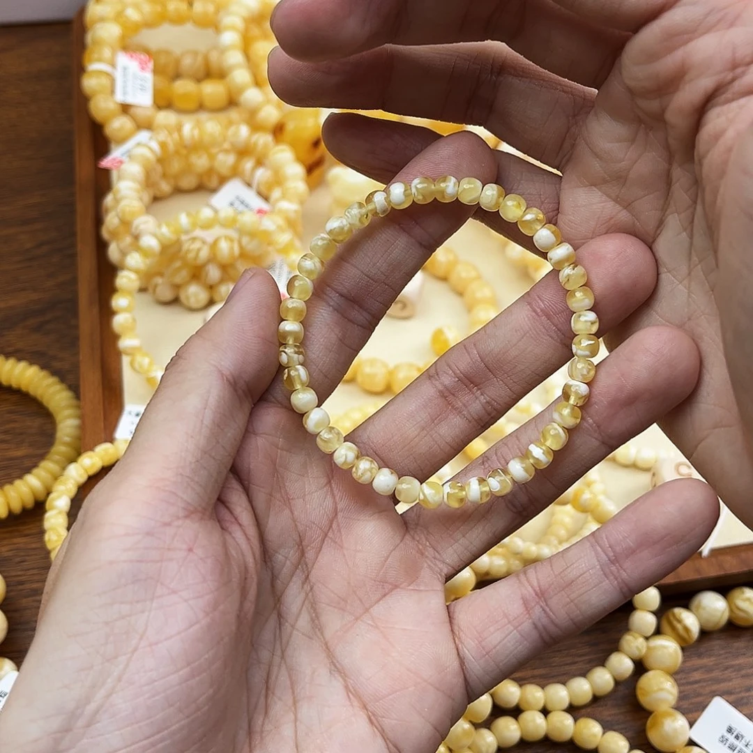 蜜蜡未镶嵌手串金瓷白妖花5.5mm