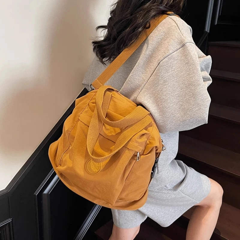 日韩水洗帆布包女慵懒风休闲手提双肩包纯色无印书包学生小背包