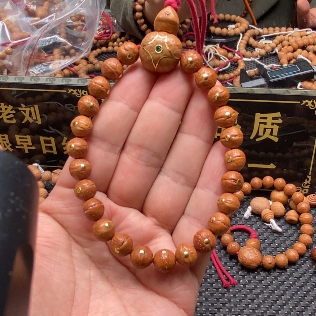 凤眼菩提吊坠9.5金钉手串