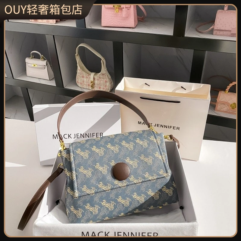 OUY法国轻奢马车真皮通勤托特包女2025新款大容量手提单肩腋下包