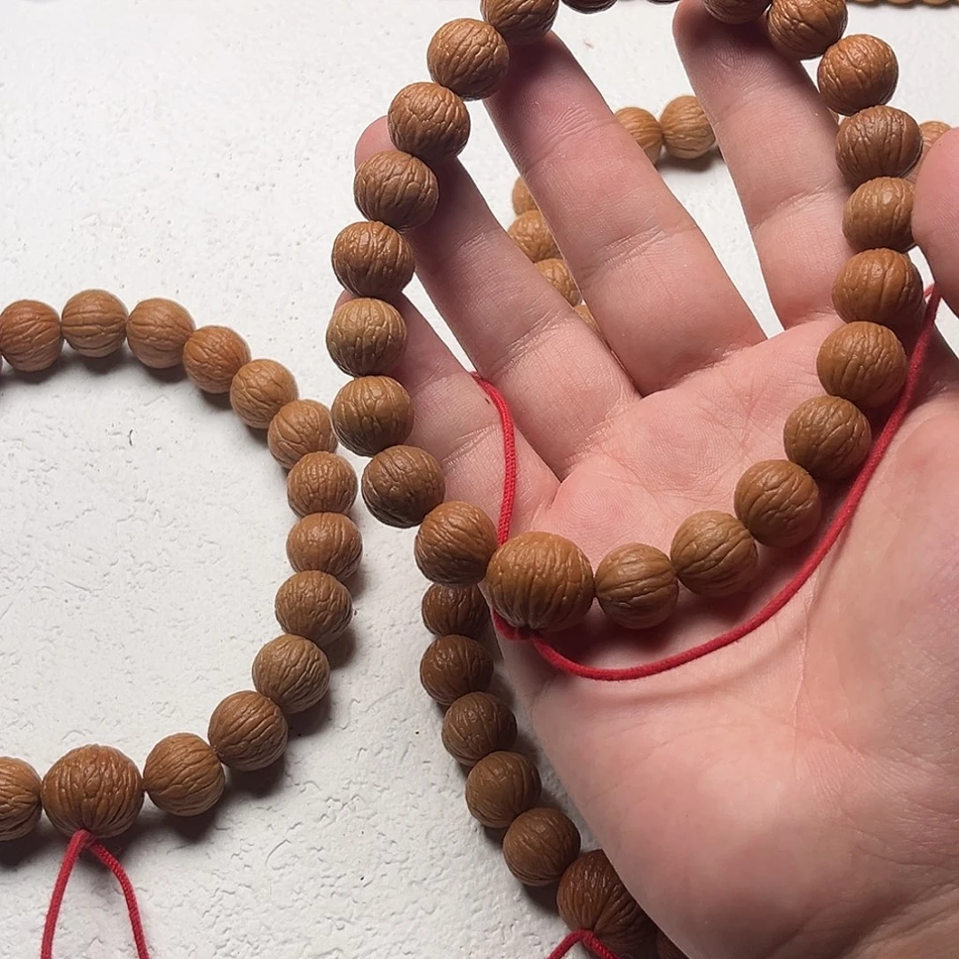 猴头核桃手串8**。凤羽原皮