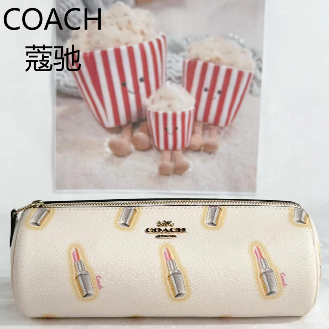 95新 COACH/蔻驰 白色花圆筒手拿包G25310606底长21X10