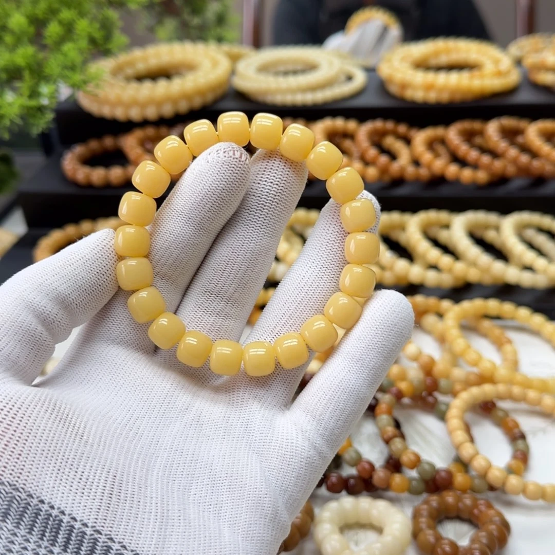 G***W手串菩提根/象牙果10*11鬼工黄透 10年