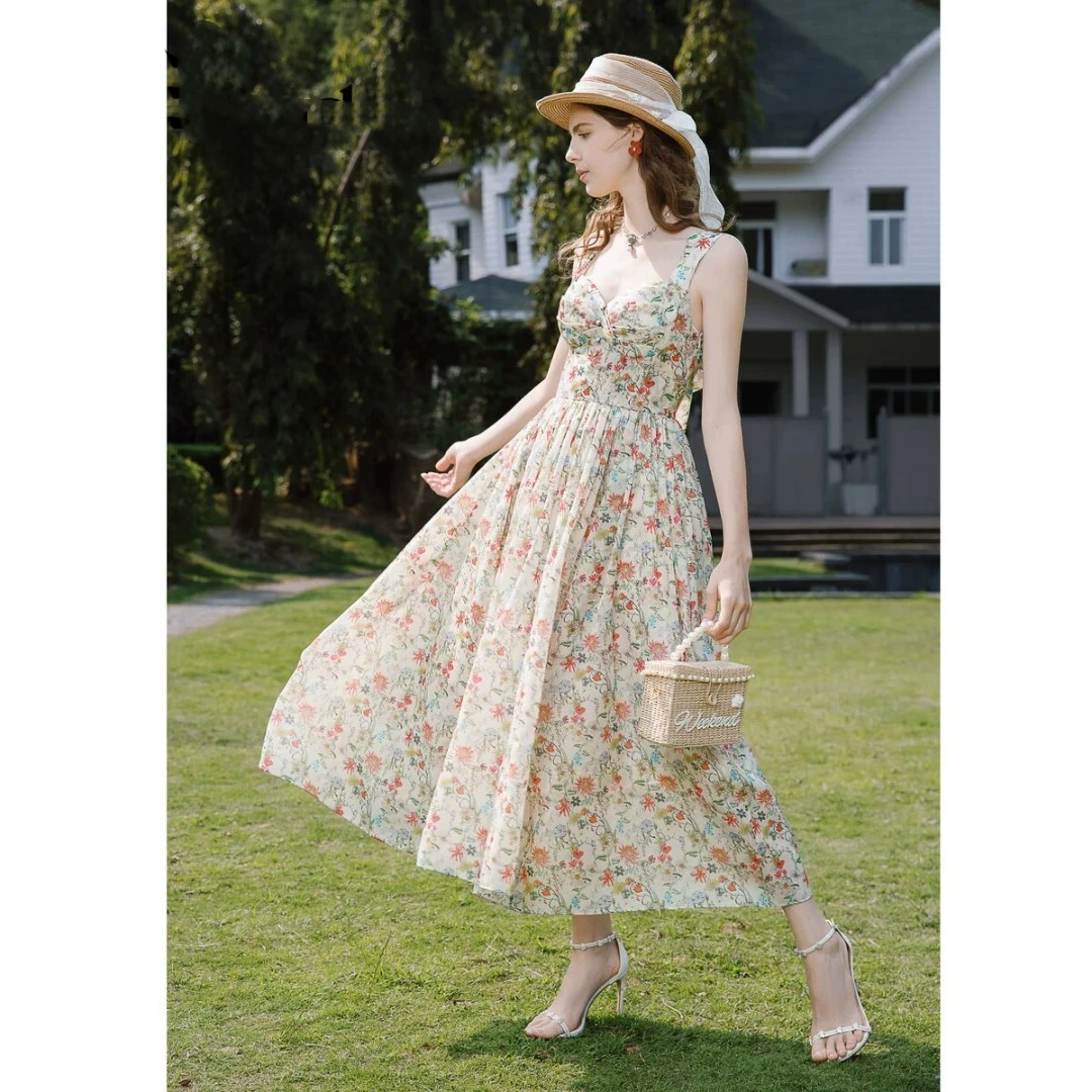 法式复古收腰印花吊带连衣裙2025夏季度假风长款A字蝴蝶结裙子