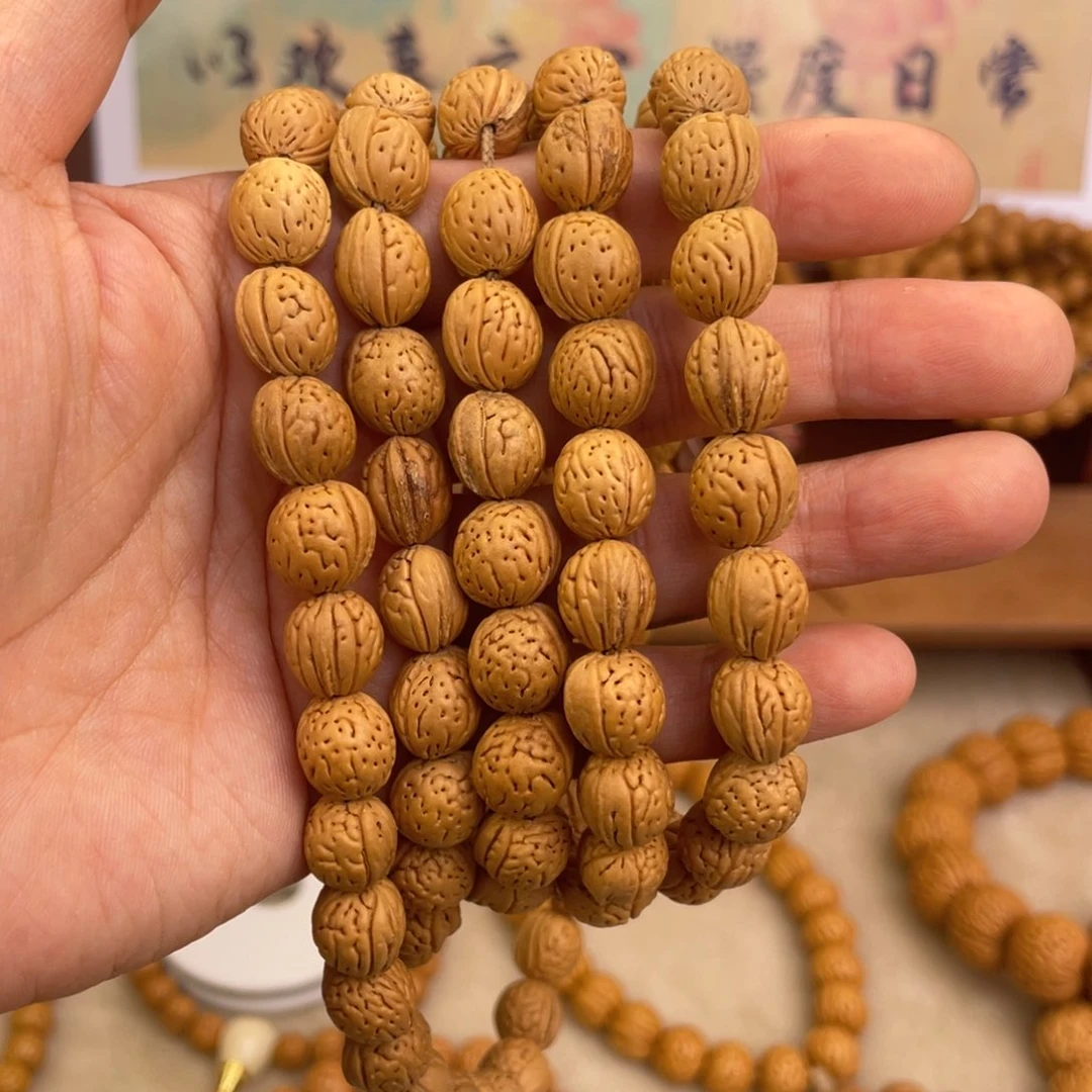桃核吊坠桃核手持东北钱袋子