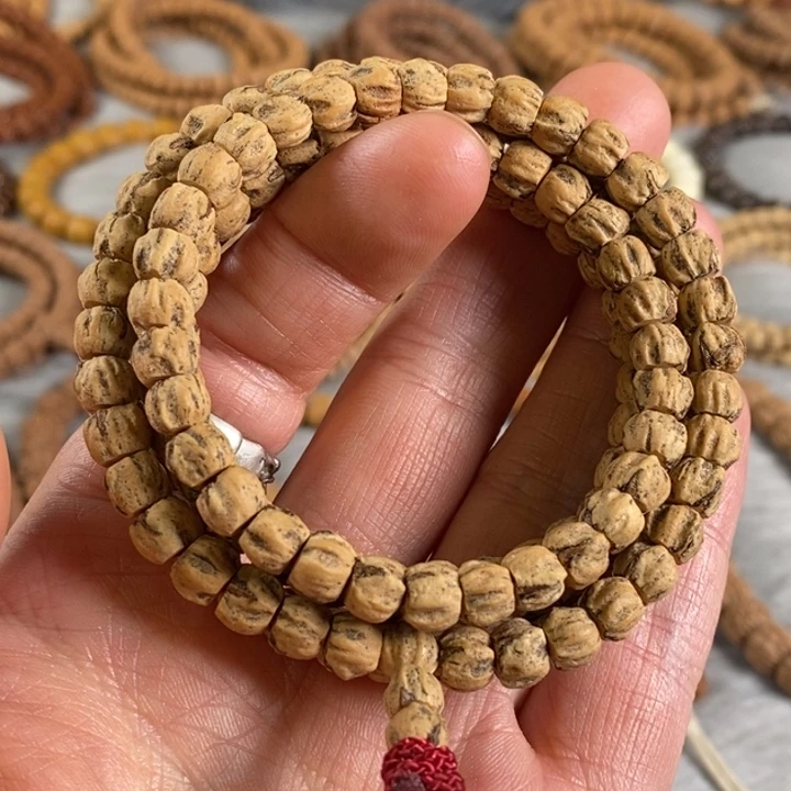 柏香籽/百香籽吊坠热振红牙后油皮百香