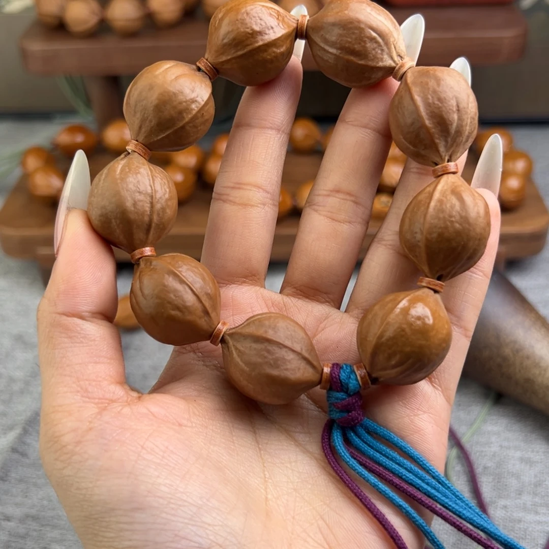 @***恼手串橄榄核21/26三花梅林铁核