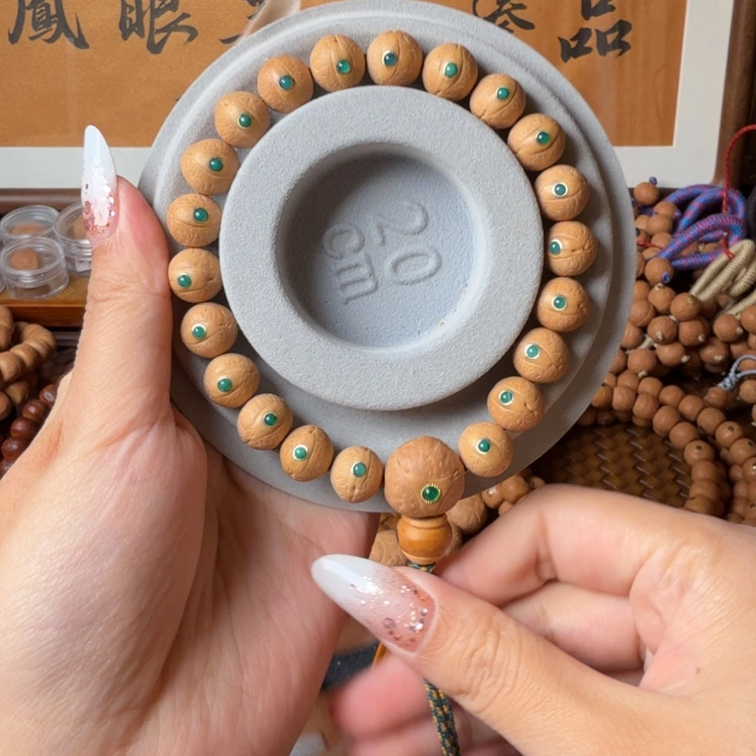 凤眼菩提把件11.5mm/镶嵌绿玛