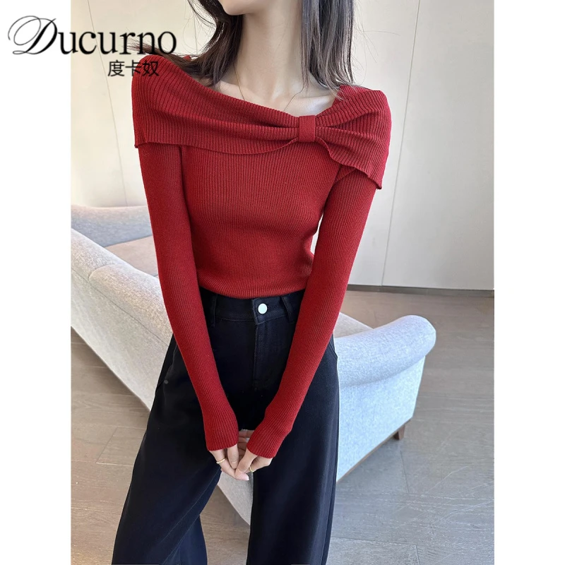 红色一字肩蝴蝶结针织衫女2025年秋季新款设计感优雅气质减龄毛衣