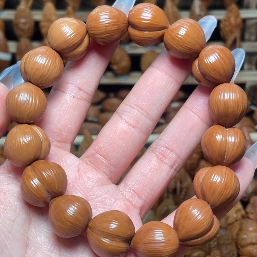 橄榄核把件后猴头手串