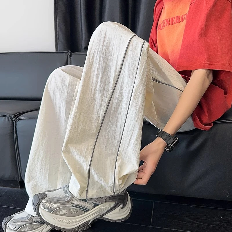 白色反光条纹休闲裤子男夏季薄款宽松直筒速干冰丝大码阔腿运动裤