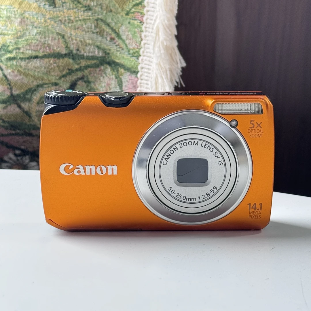 95新 Canon/佳能 A3200橙色1410w像素5x光学变焦ccd数码相机