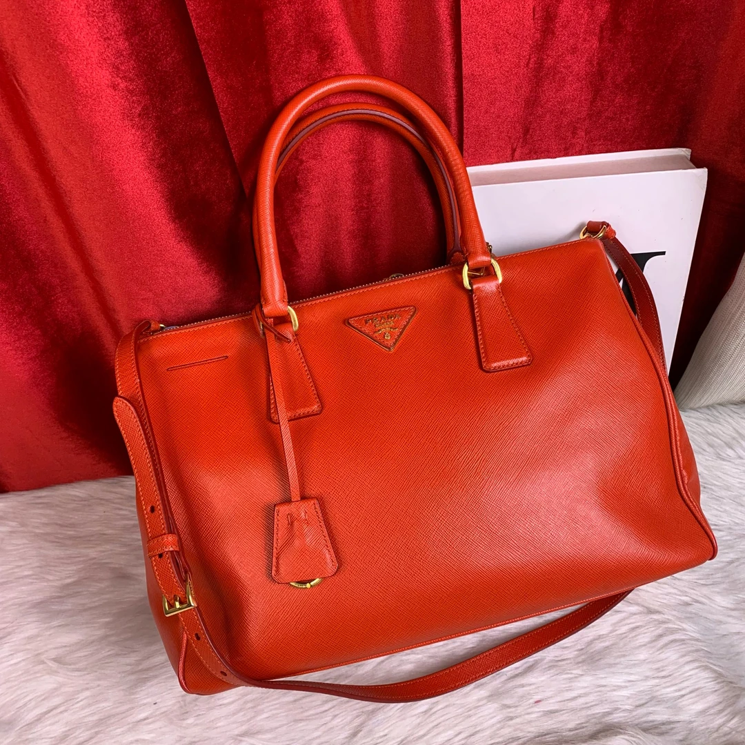 95新 Prada/普拉达 西柚色杀手包/EE08728019/8019