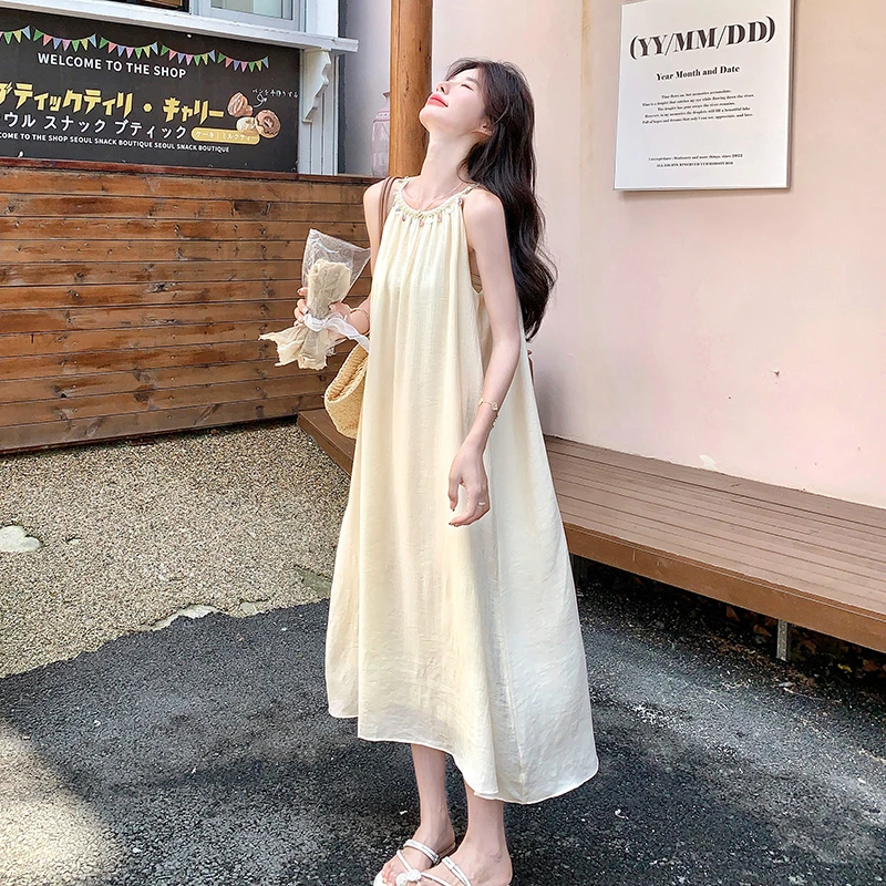 空调感高级感海边度假藏肉挂脖连衣裙法式长裙温柔白色裙子女夏季