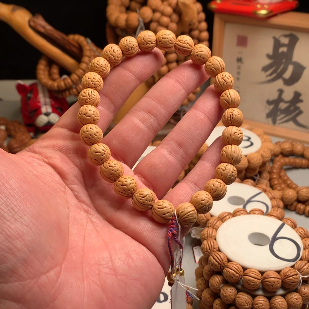 L***施桃核手串1.2小金芽桃核手持