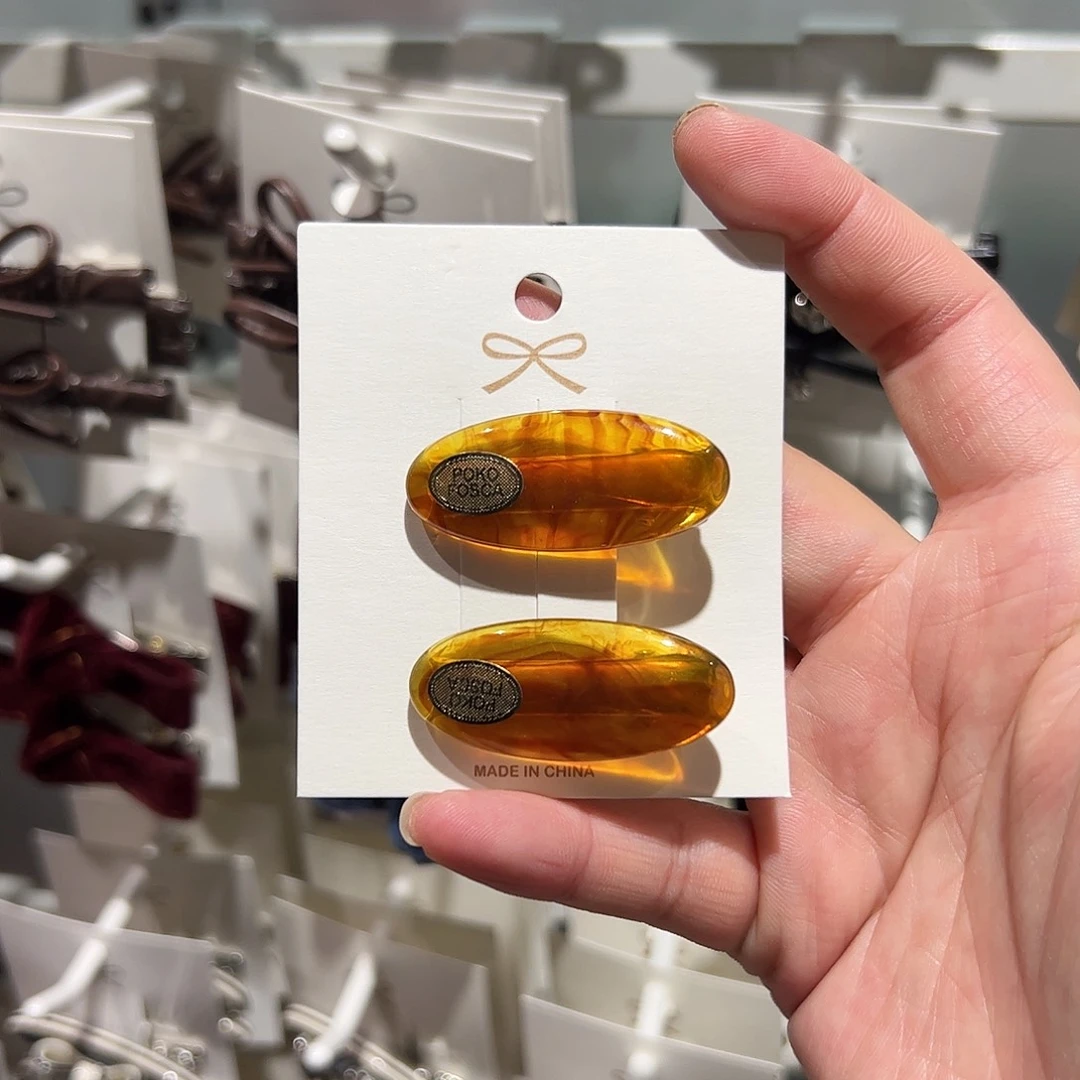 布艺非金属琥珀色压夹