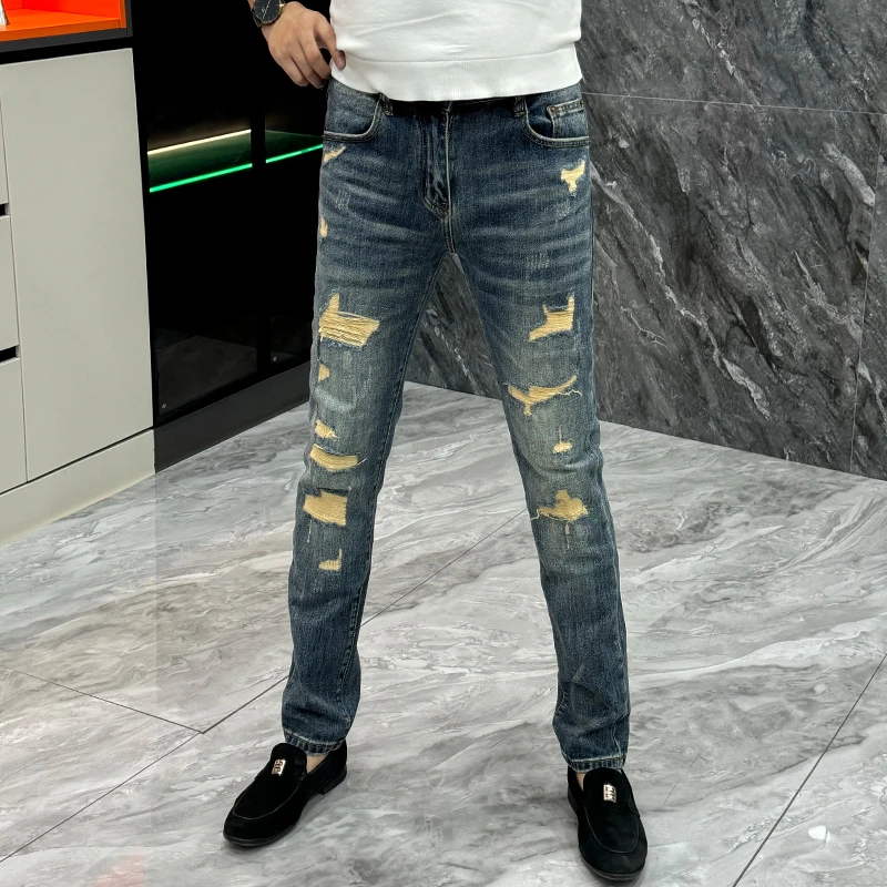 秋冬新款破洞补丁牛仔裤男欧货痞帅个性修身小脚裤百搭休闲长裤子