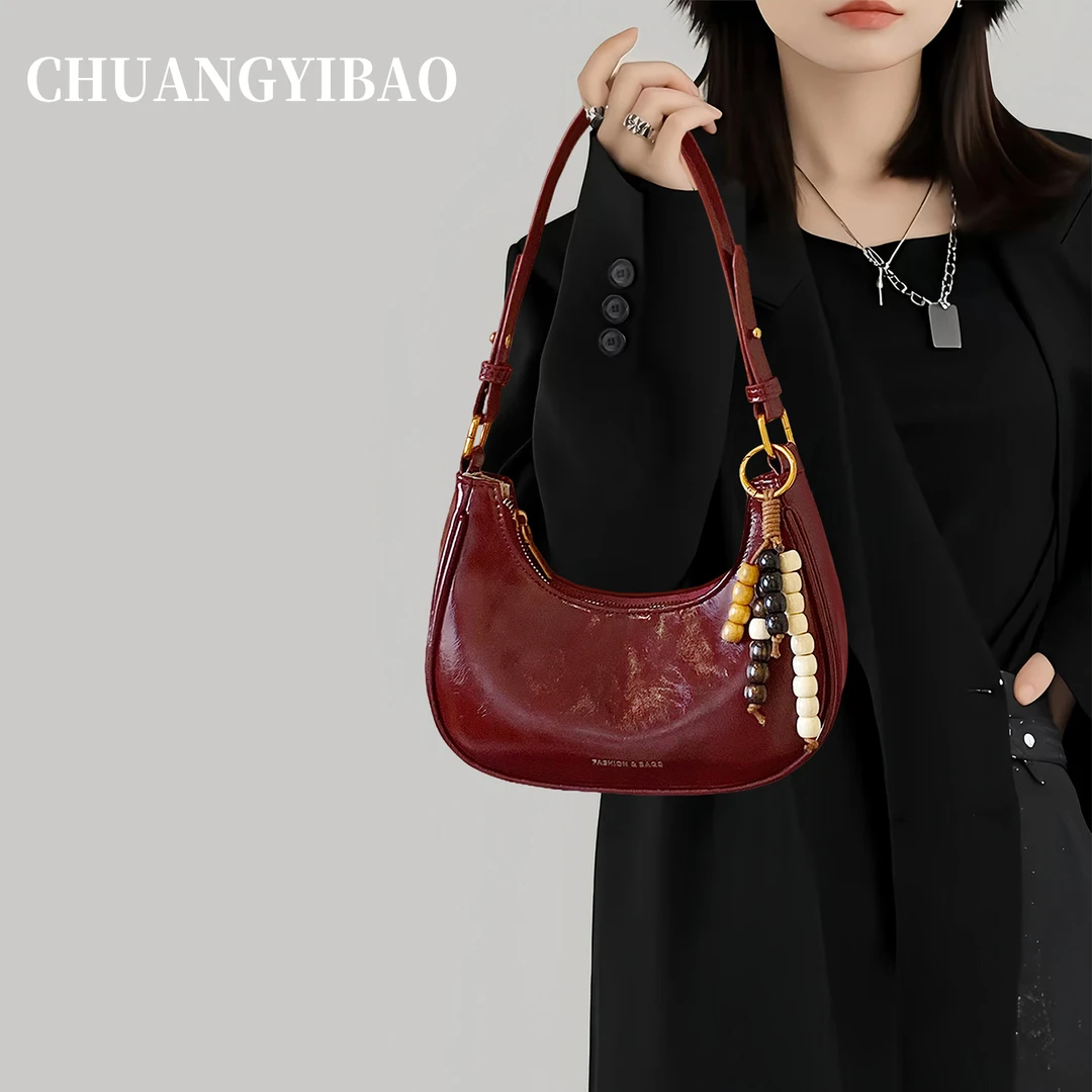 红色腋下月牙包包女式2025新款高端大气高级感轻奢小众设计斜挎包