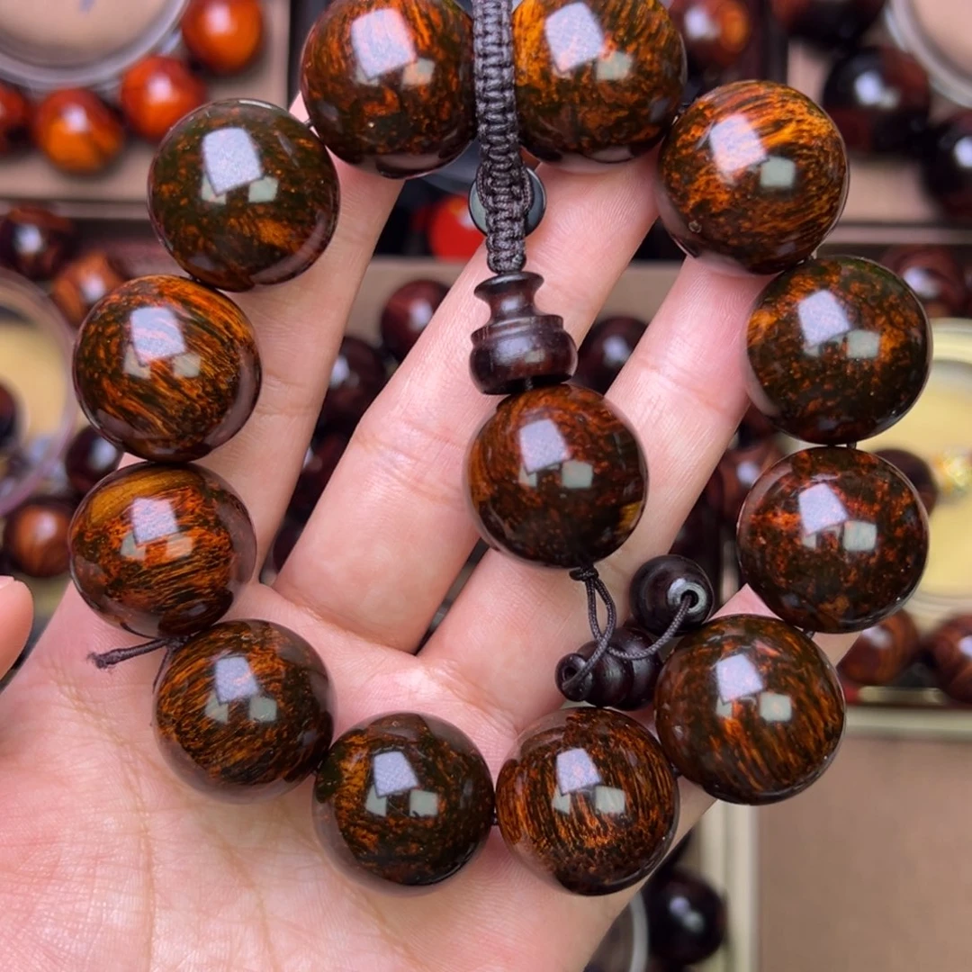 木质类黄花梨鬼脸对眼成品手串