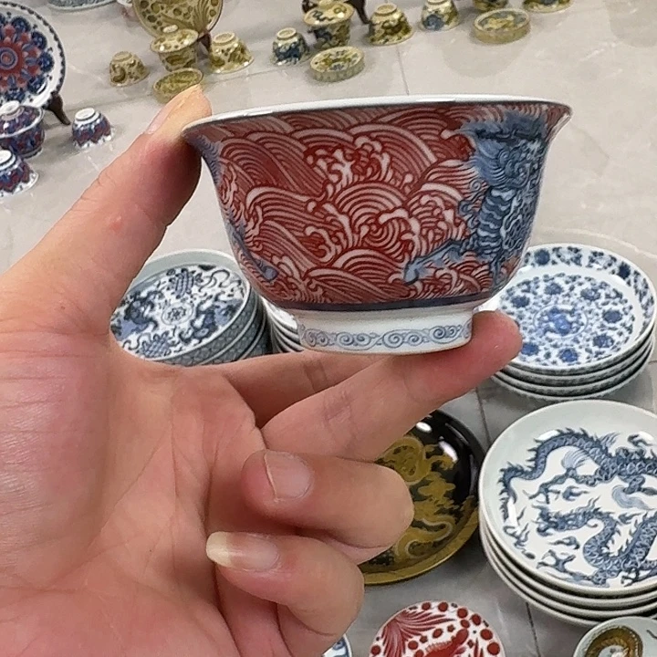 瓷片釉里红麒麟踏浪主人杯