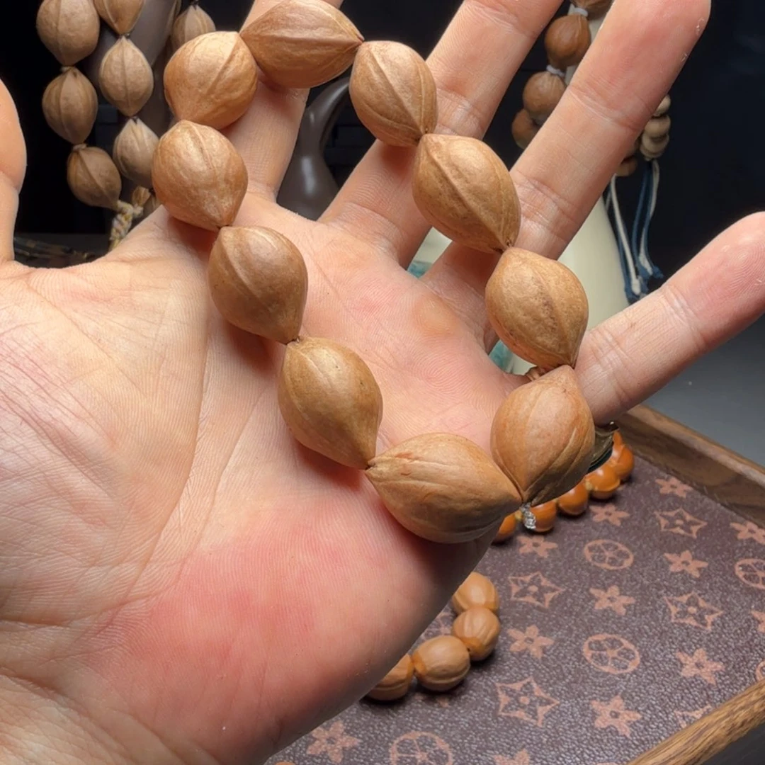 桃核吊坠马***子素核手串666888