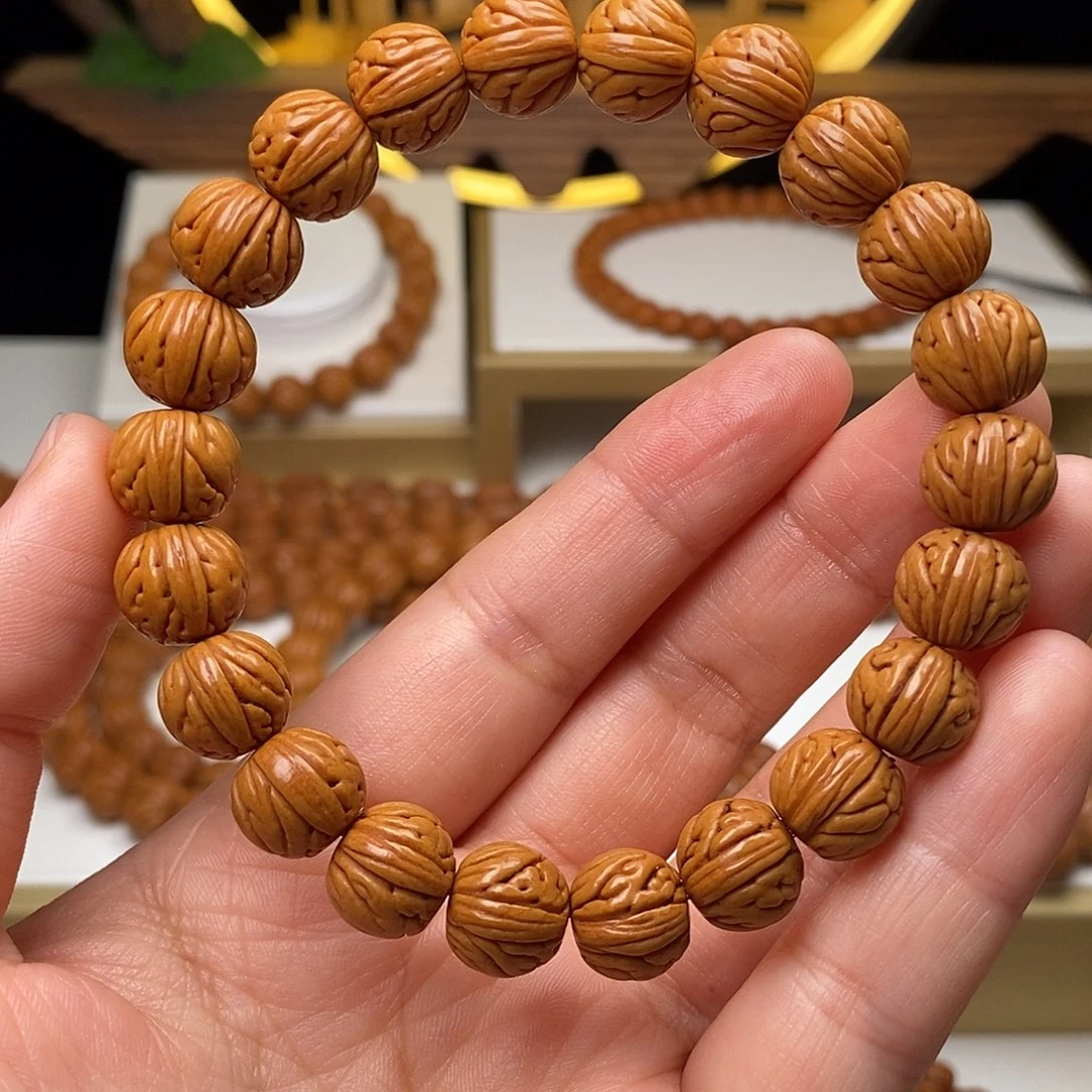 明***日桃核手串11mm野生金麒麟桃核手串