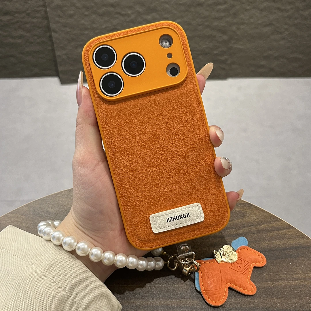 橙色素皮纹适用苹果17promax手机壳13/16pro手提挂链iphone15/14