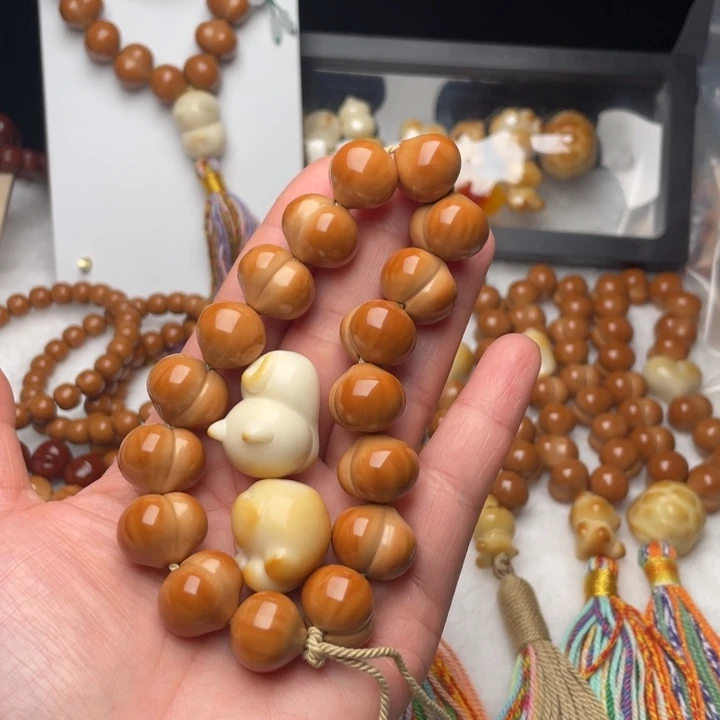 蜜***.手串猴头核桃聚宝盆