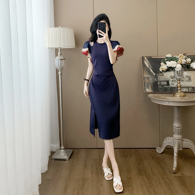 设计感小众拼接撞色荷叶袖裙子2025夏新款气质复古镂空钉珠连衣裙