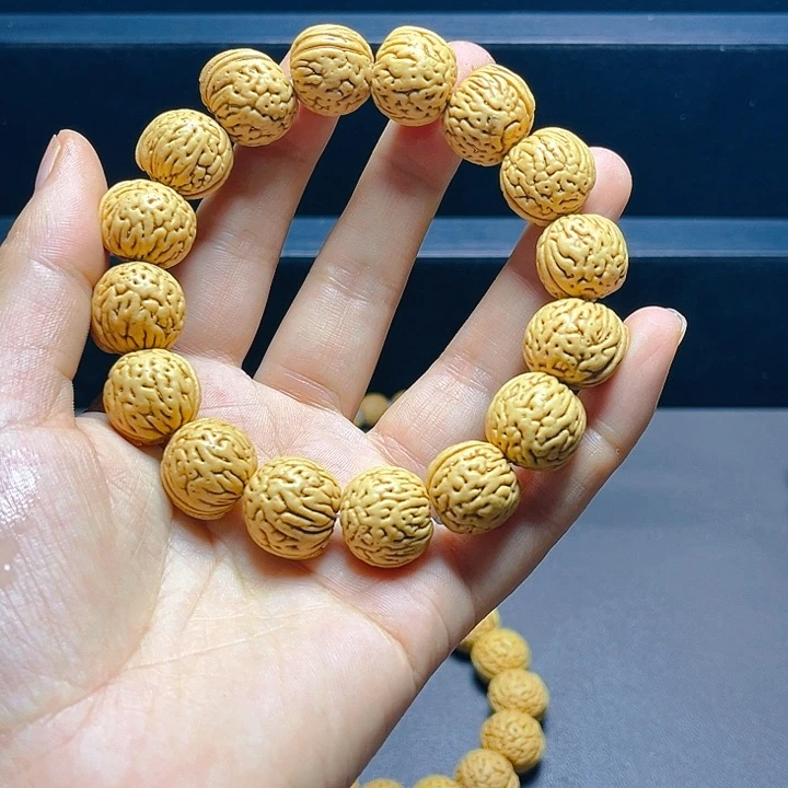 桃核吊坠金豆手串