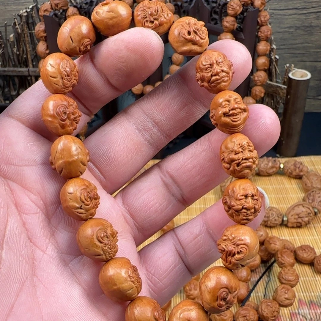 仧***精工雕刻龙纹桃核十八罗汉一物一图
